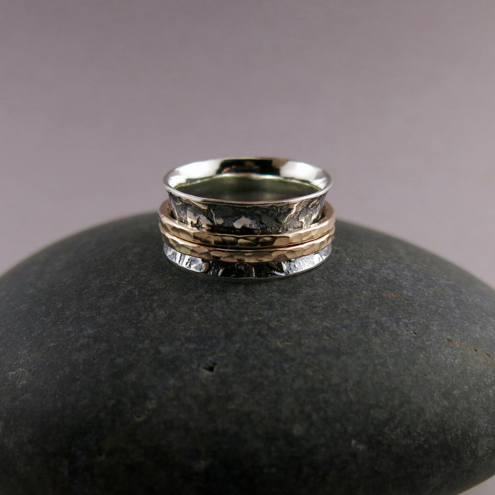 Leopard print meditation ring in blackened silver and gold spinning bands by Mikel Grant Jewellery