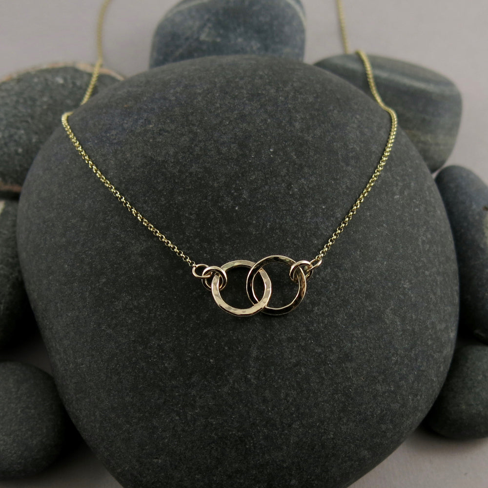 Solid 14K gold embrace necklace by Mikel Grant Jewellery