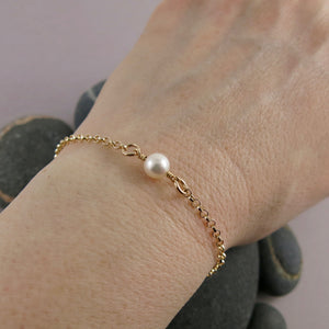 Delicate luxe single pearl bracelet in 14K gold by Mikel Grant Jewellery