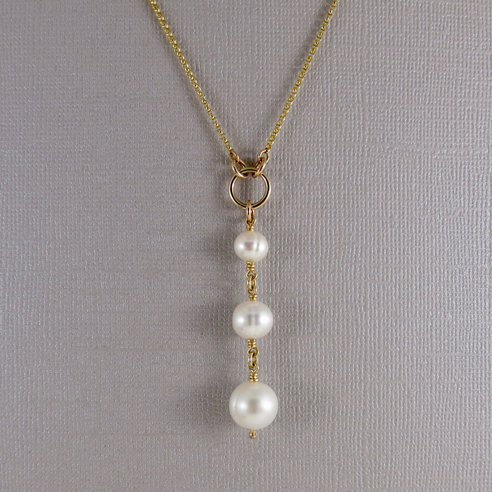 Pearl trio drop necklace in 14K gold by Mikel Grant Jewellery. Luxe wedding jewellery with white freshwater pearls.