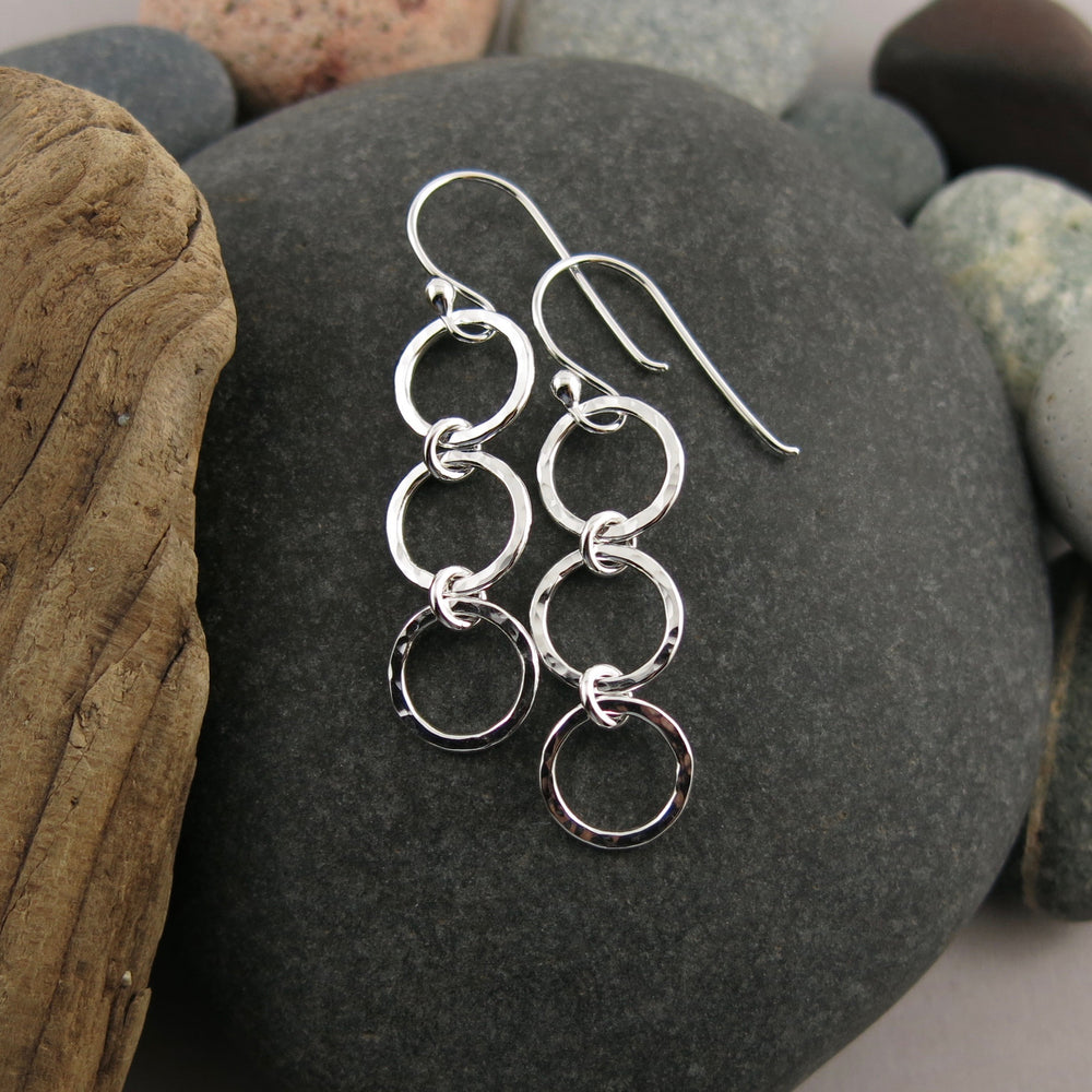 Breathe Trio Drop Earrings: hammer textured sterling silver open circle trio drop earrings by Mikel Grant Jewellery.   Artisan made on the Sunshine Coast of BC.