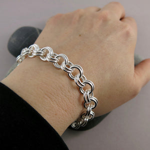 Artisan made heavy double chain link bracelet is silver by Mikel Grant Jewellery. Displayed on an arm.