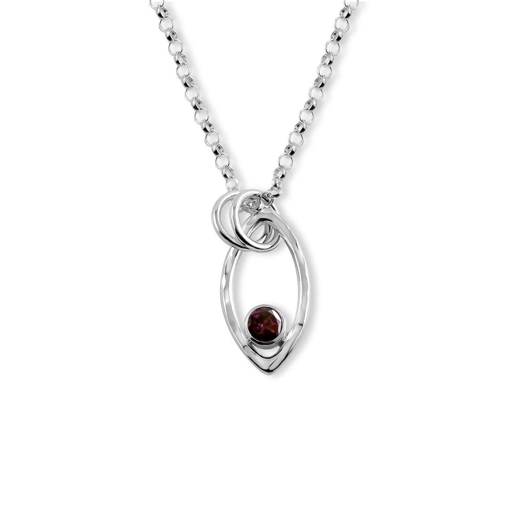 Modern minimalist sterling silver leaf necklace with faceted garnet gemstone by Mikel Grant Jewellery.
