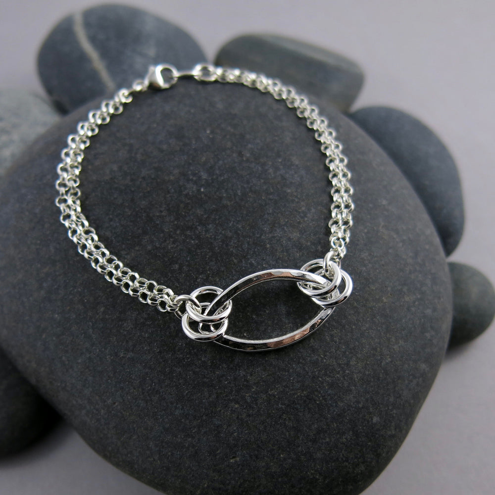 Modern minimalist silver leaf bracelet by Mikel Grant Jewellery. 