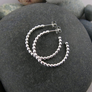 Beaded sterling silver open hoop studs by Mikel Grant Jewellery. Artisan made on the Sunshine Coast of BC.