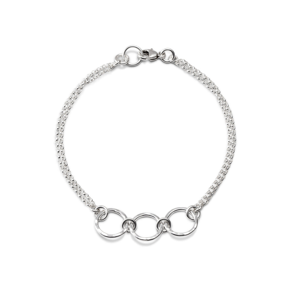 Silver open circle trio bracelet by Mikel Grant Jewellery. Hammer textured breathe trio bracelet.