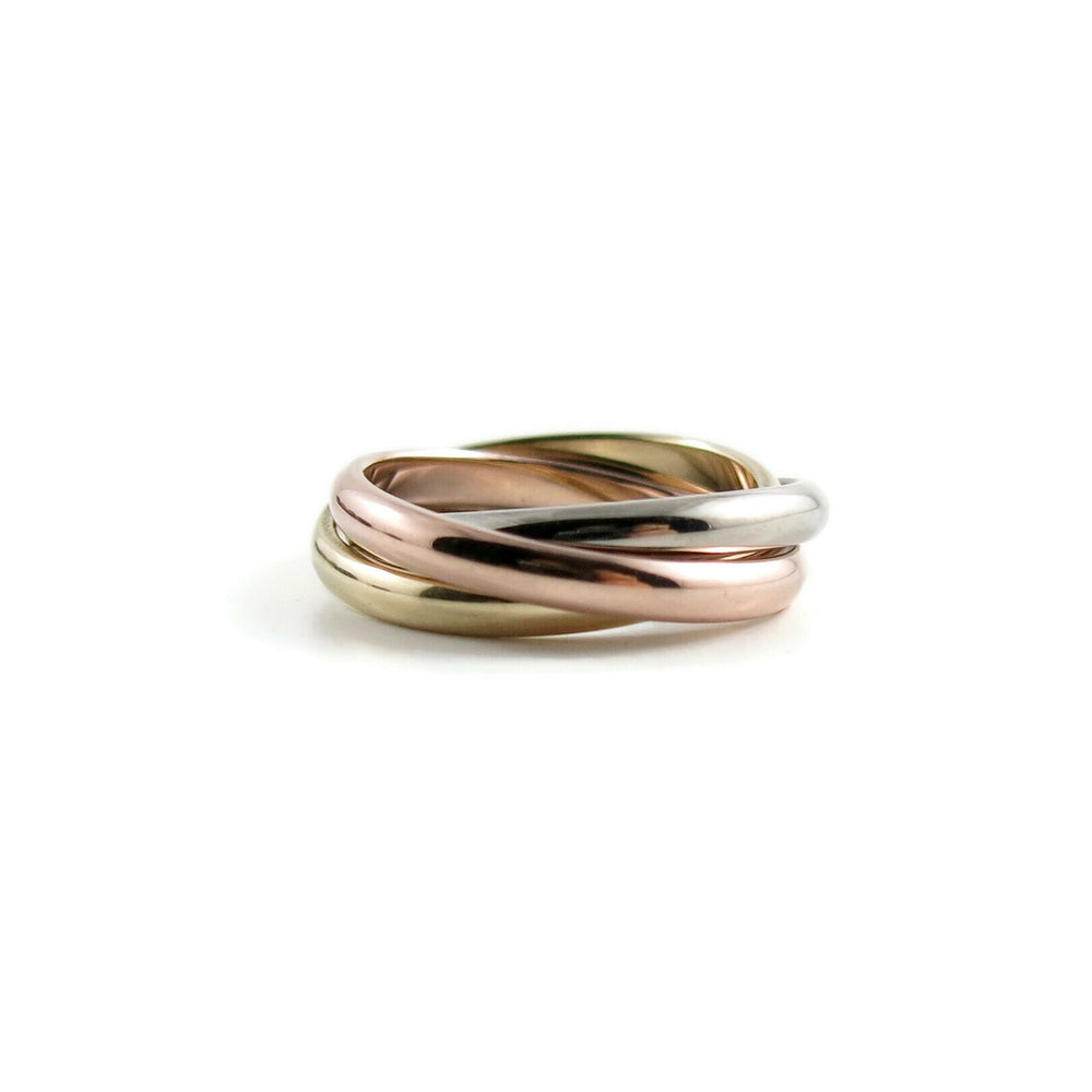 Mixed gold trinity rolling ring by Mikel Grant Jewellery. 14K yellow, rose & white gold Russian wedding ring.