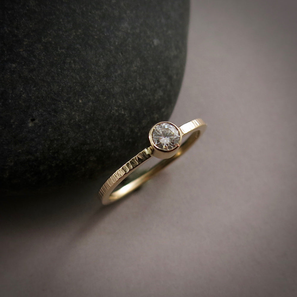 Gold Moissanite Ring by Mikel Grant Jewellery. Soft square bark textured 14K gold band with bezel-set Moissanite.