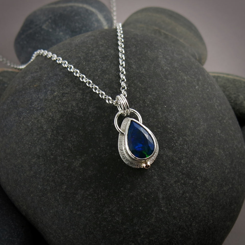 Black Welo opal teardrop necklace in sterling silver & 14K gold by Mikel Grant Jewellery