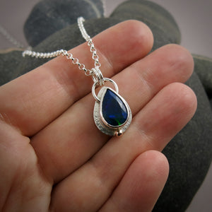 Black Welo opal teardrop necklace in sterling silver & 14K gold by Mikel Grant Jewellery