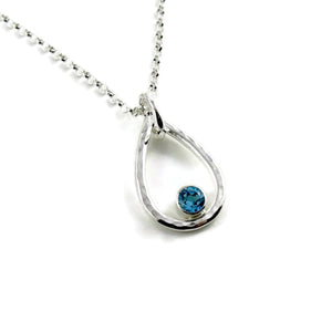 Blue topaz raindrop necklace in hammered sterling silver by Mikel Grant Jewellery