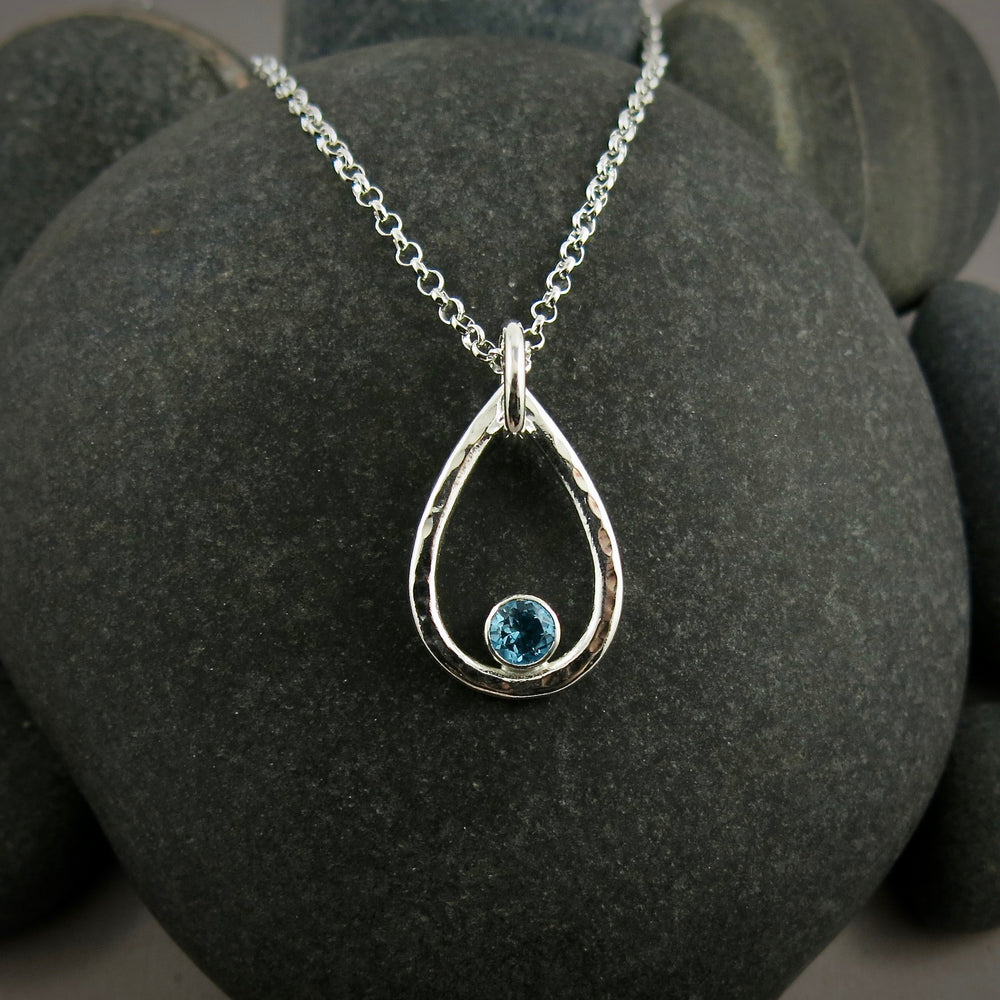 Blue topaz raindrop necklace in hammered sterling silver by Mikel Grant Jewellery