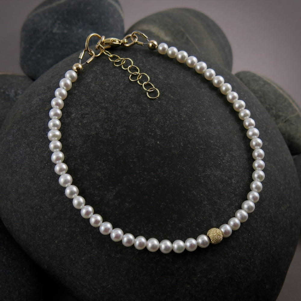 Dainty white akoya pearl bracelet with 14K gold filled accents by Mikel Grant Jewellery