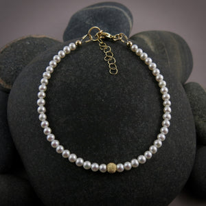 Dainty white akoya pearl bracelet with 14K gold filled accents by Mikel Grant Jewellery