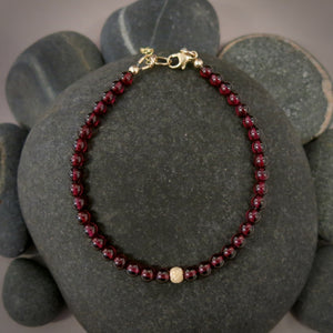 Garnet gemstone bead bracelet with sterling silver or 14K gold fill accents by Mikel Grant Jewellery