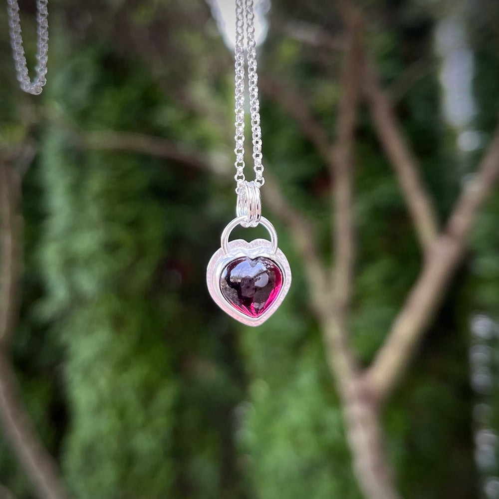 Carved garnet gemstone heart necklace in sterling silver by Mikel Grant Jewellery