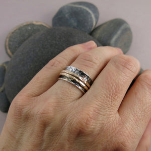 Giraffe print meditation ring on oxidized silver with gold spinning bands by Mikel Grant Jewellery