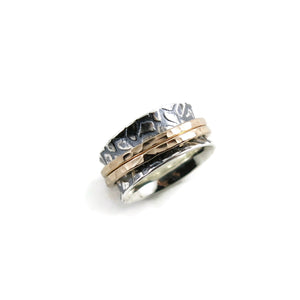 Giraffe print meditation ring on oxidized silver with gold spinning bands by Mikel Grant Jewellery