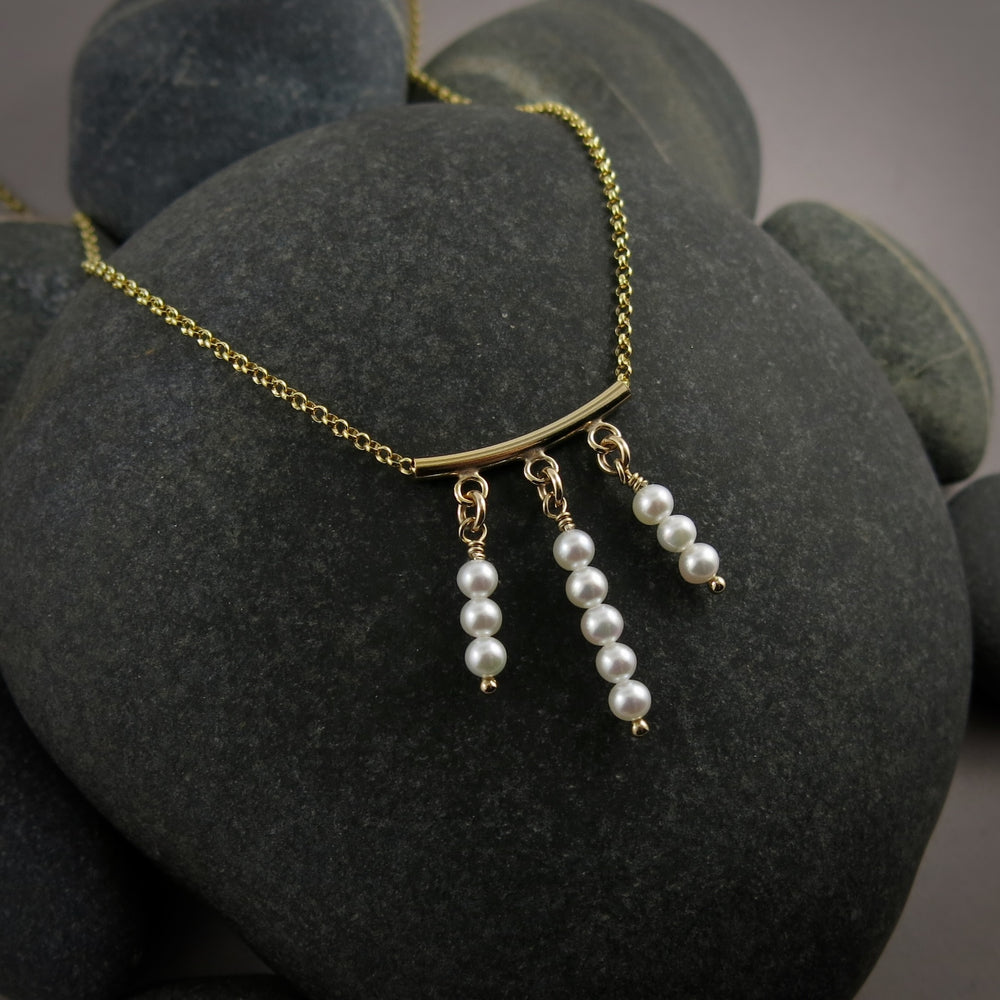 Gold festoon necklace with white akoya pearls by Mikel Grant Jewellery