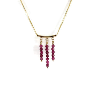 Gold festoon necklace with rubies by Mikel Grant Jewellery.