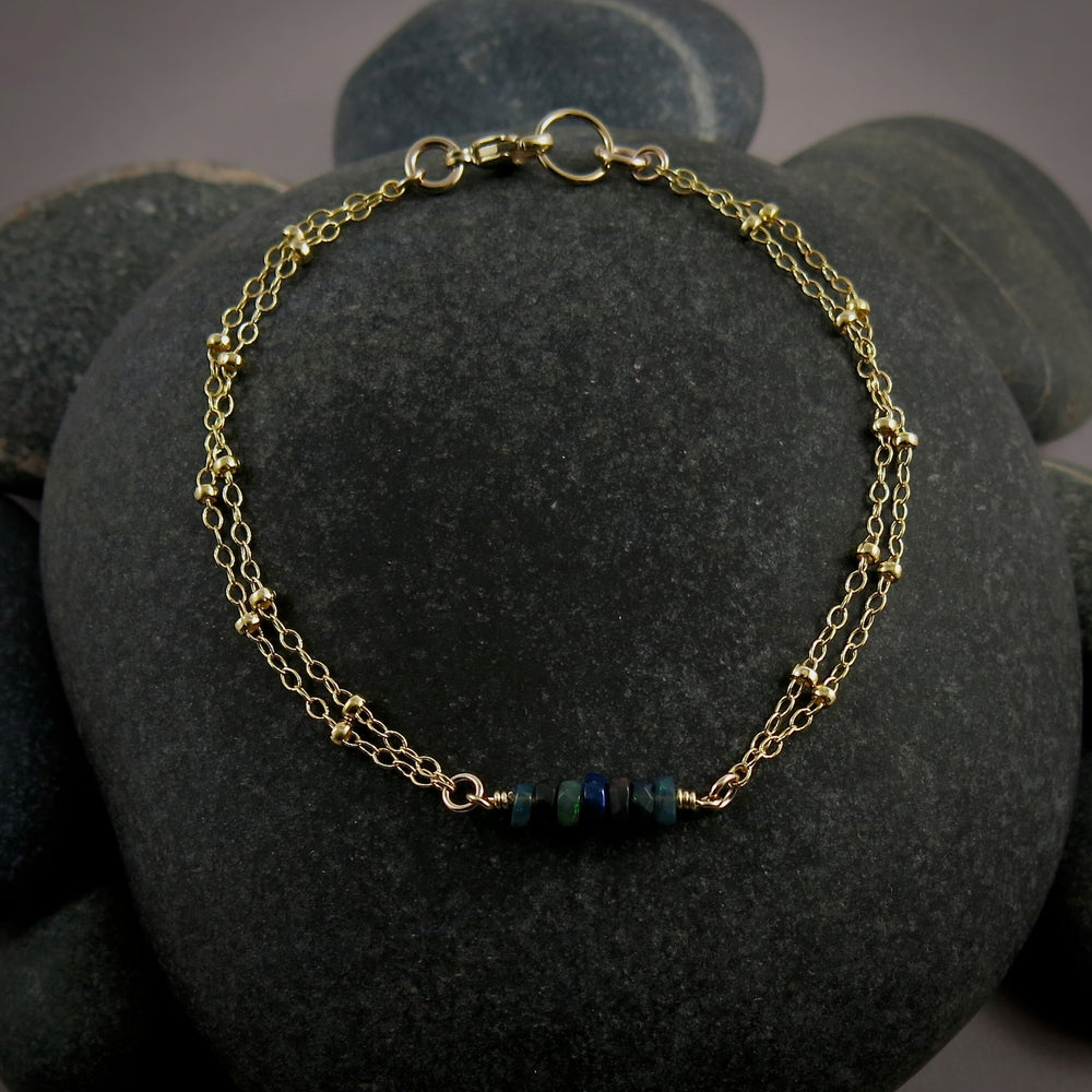 Gold double strand satellite chain bracelet with black opal beads by Mikel Grant Jewellery