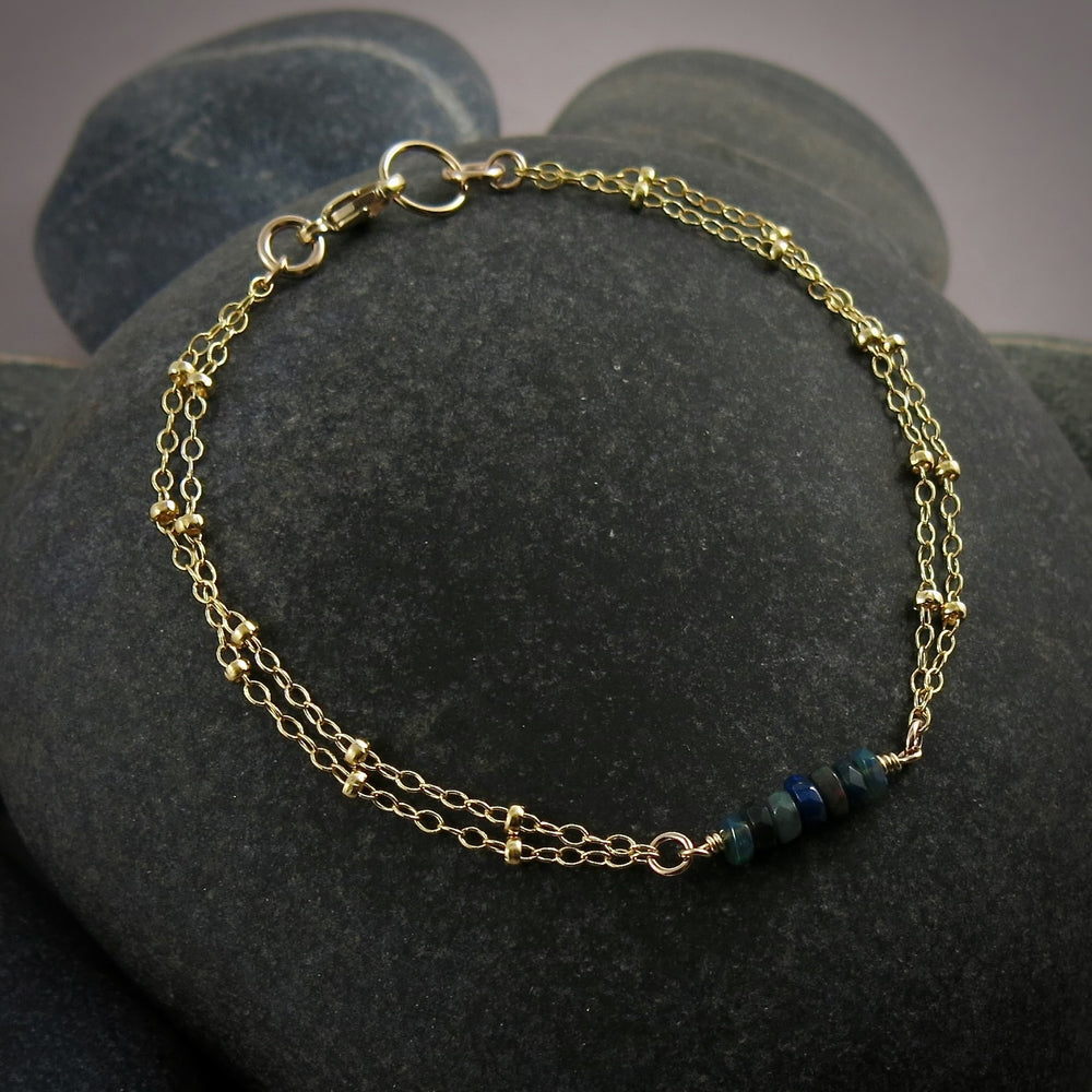 Gold double strand satellite chain bracelet with black opal beads by Mikel Grant Jewellery