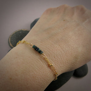 Gold double strand satellite chain bracelet with black opal beads by Mikel Grant Jewellery