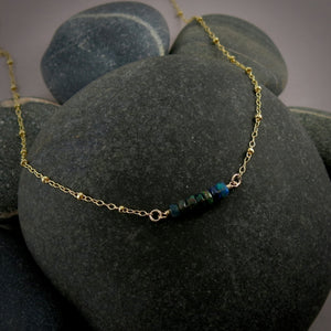 Gold satellite chain necklace with black opal beads by Mikel Grant Jewellery