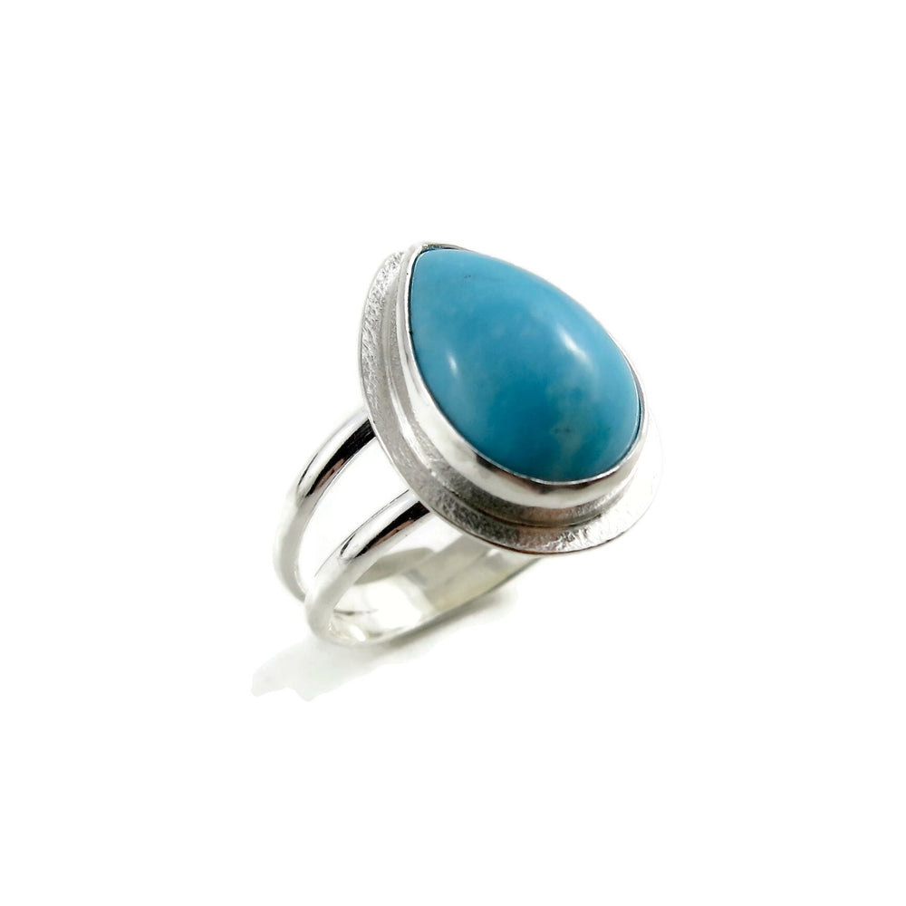 Kingman turquoise teardrop split-shank ring in sterling silver by Mikel Grant Jewellery.  Size 8.