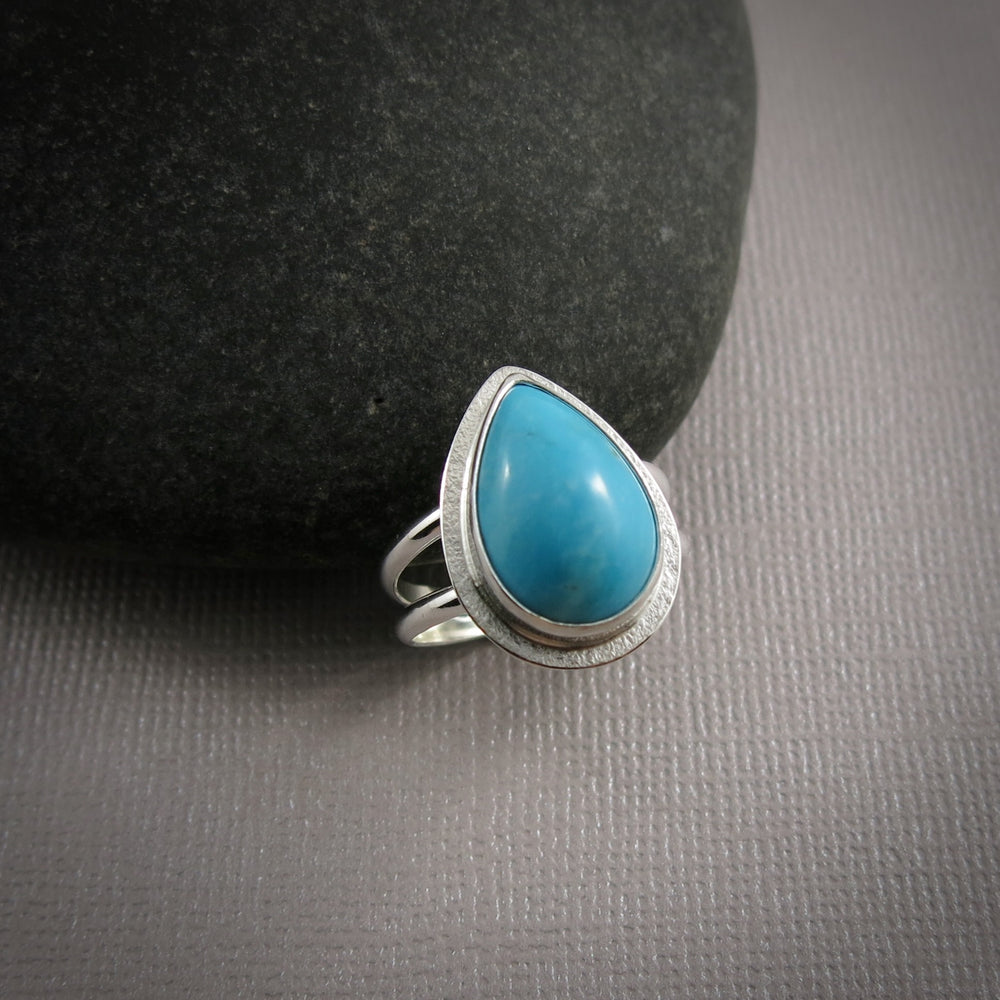 Kingman turquoise teardrop split-shank ring in sterling silver by Mikel Grant Jewellery.  Size 8.