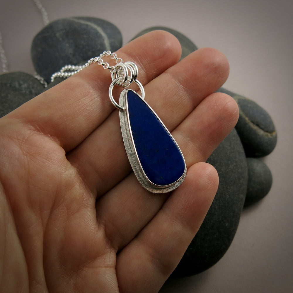 Lapis lazuli teardrop halo necklace in sterling silver by Mikel Grant Jewellery.