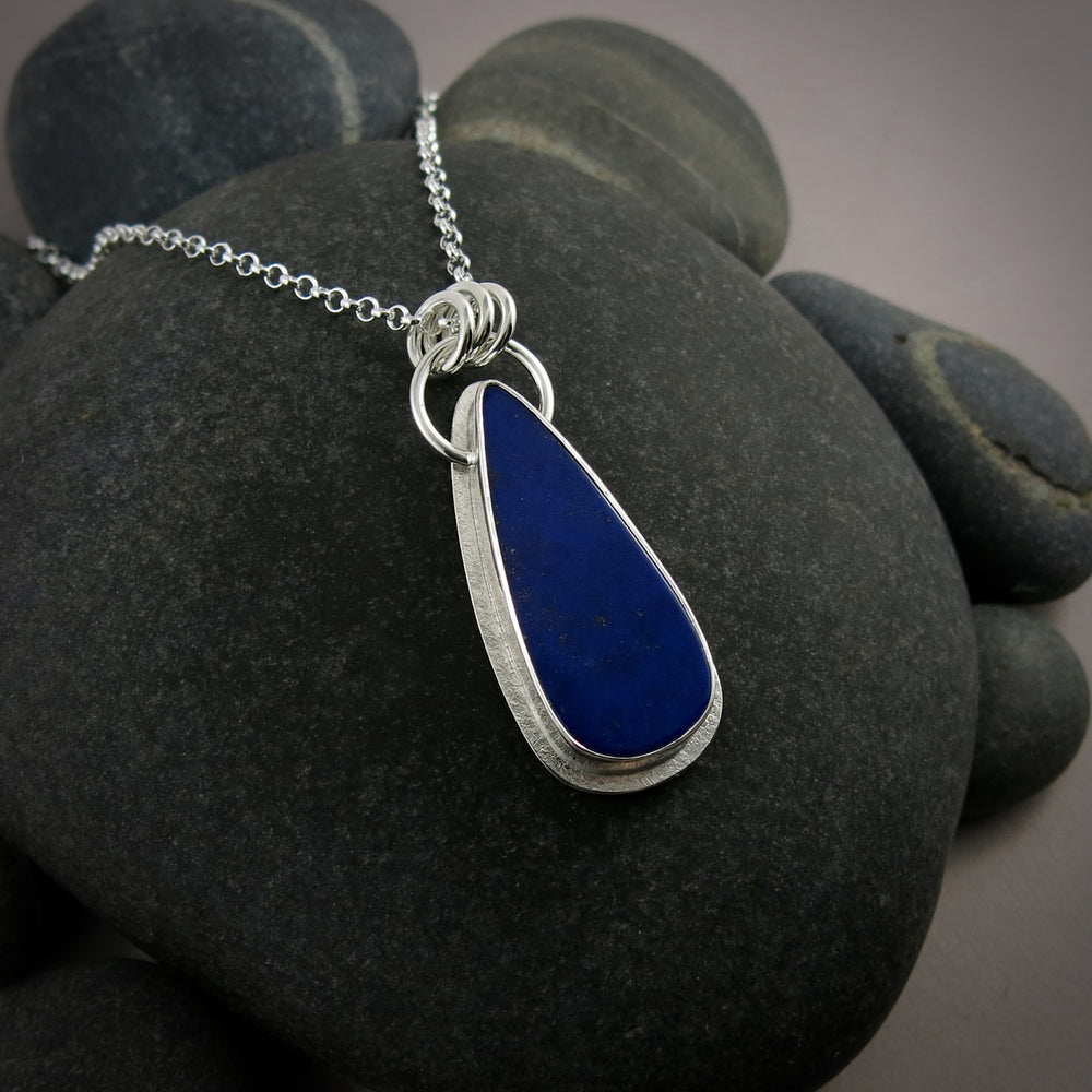 Lapis lazuli teardrop halo necklace in sterling silver by Mikel Grant Jewellery.