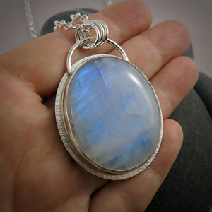 Large oval rainbow moonstone necklace in sterling silver by Mikel Grant Jewellery