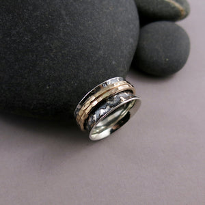 Leopard print meditation ring in blackened silver and gold spinning bands by Mikel Grant Jewellery