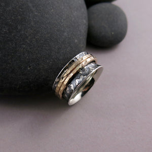 Leopard print meditation ring in blackened silver and gold spinning bands by Mikel Grant Jewellery