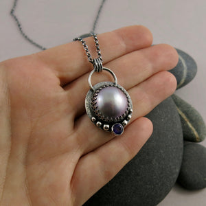 Lilac mabe pearl necklace with amethyst in oxidized sterling silver by Mikel Grant Jewellery.