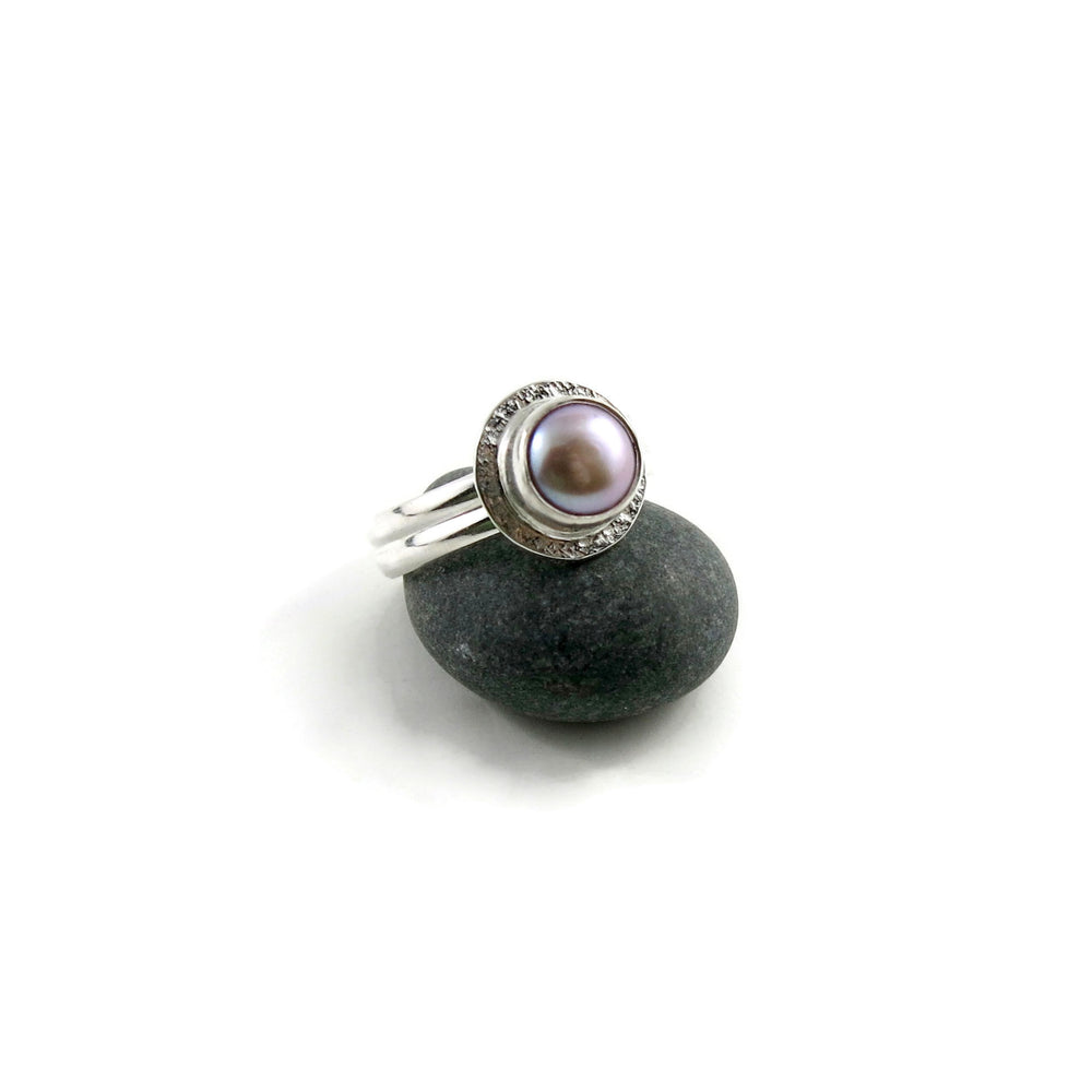 Petite pink button pearl halo ring in sterling silver by Mikel Grant Jewellery