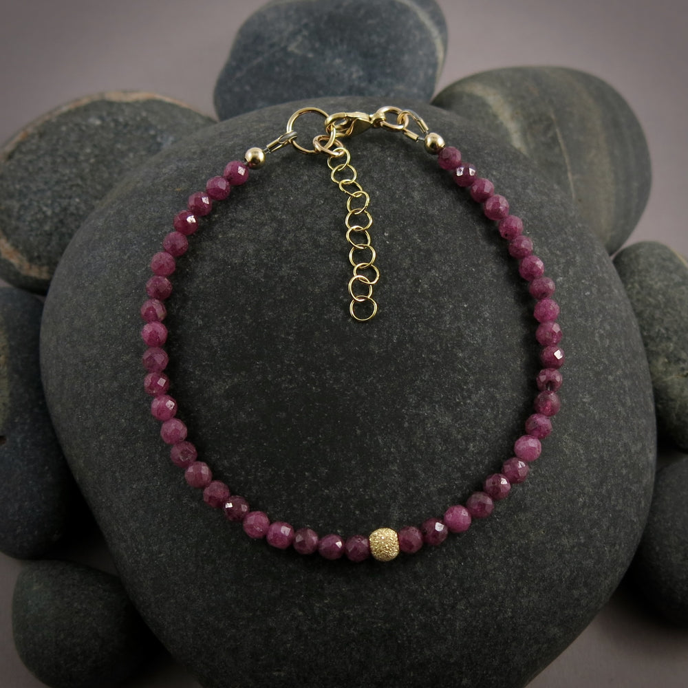 Dainty ruby gemstone bead bracelet with 14K gold filled accents by Mikel Grant Jewellery.