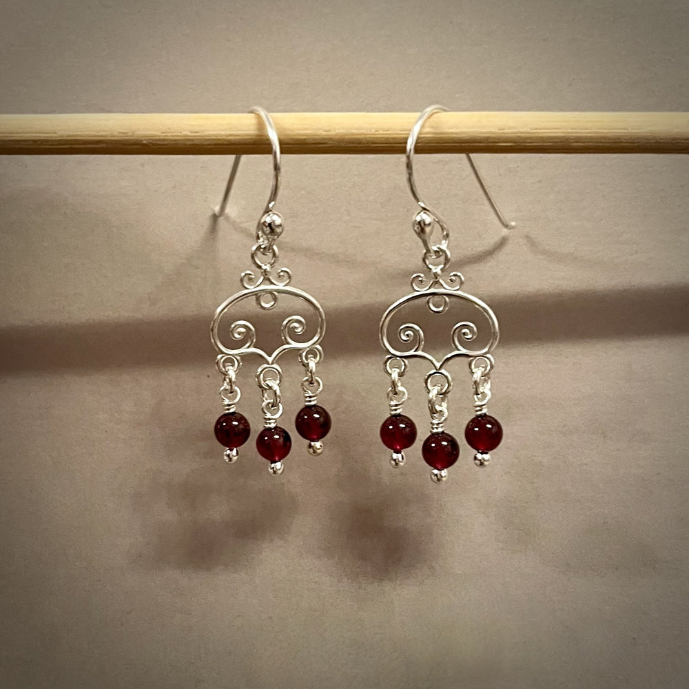 Silver scroll earrings with garnet bead drops by Mikel Grant Jewellery