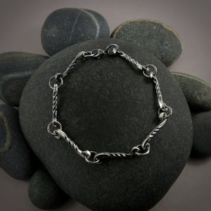 Silver twisted scrolls link bracelet by Mikel Grant Jewellery