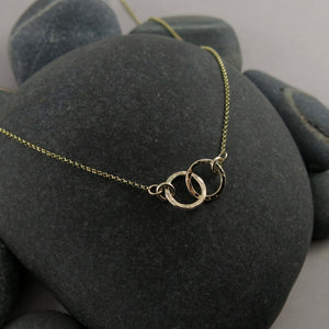 Solid 14K gold embrace necklace by Mikel Grant Jewellery