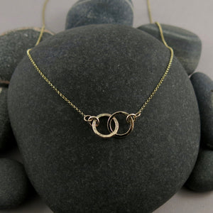 Solid 14K gold embrace necklace by Mikel Grant Jewellery