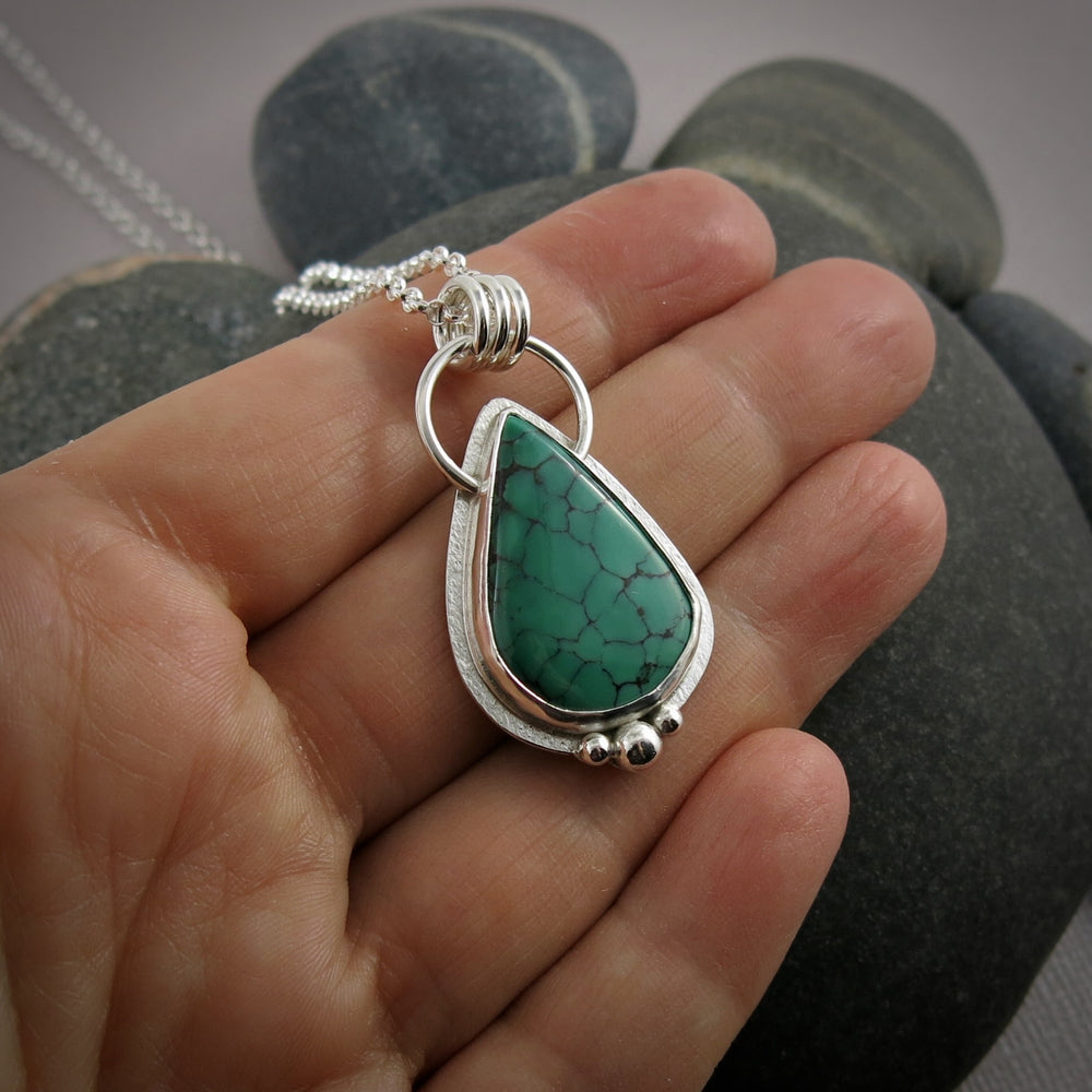 Spiderweb Hubei teardrop turquoise pendant in sterling silver by Mikel Grant Jewellery