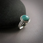 Tibetan turquoise halo ring in sterling silver by Mikel Grant Jewellery.  Size 7.
