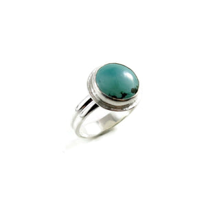 Tibetan turquoise halo ring in sterling silver by Mikel Grant Jewellery.  Size 7.