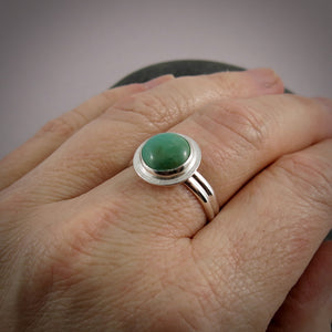 Tibetan turquoise halo ring in sterling silver by Mikel Grant Jewellery.  Size 10.