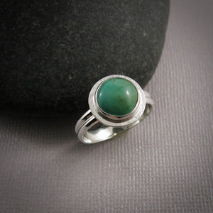 Tibetan turquoise halo ring in sterling silver by Mikel Grant Jewellery.  Size 10.