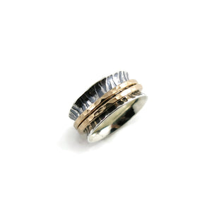 Tiger print meditation ring on oxidized silver with gold spinning bands by Mikel Grant Jewellery