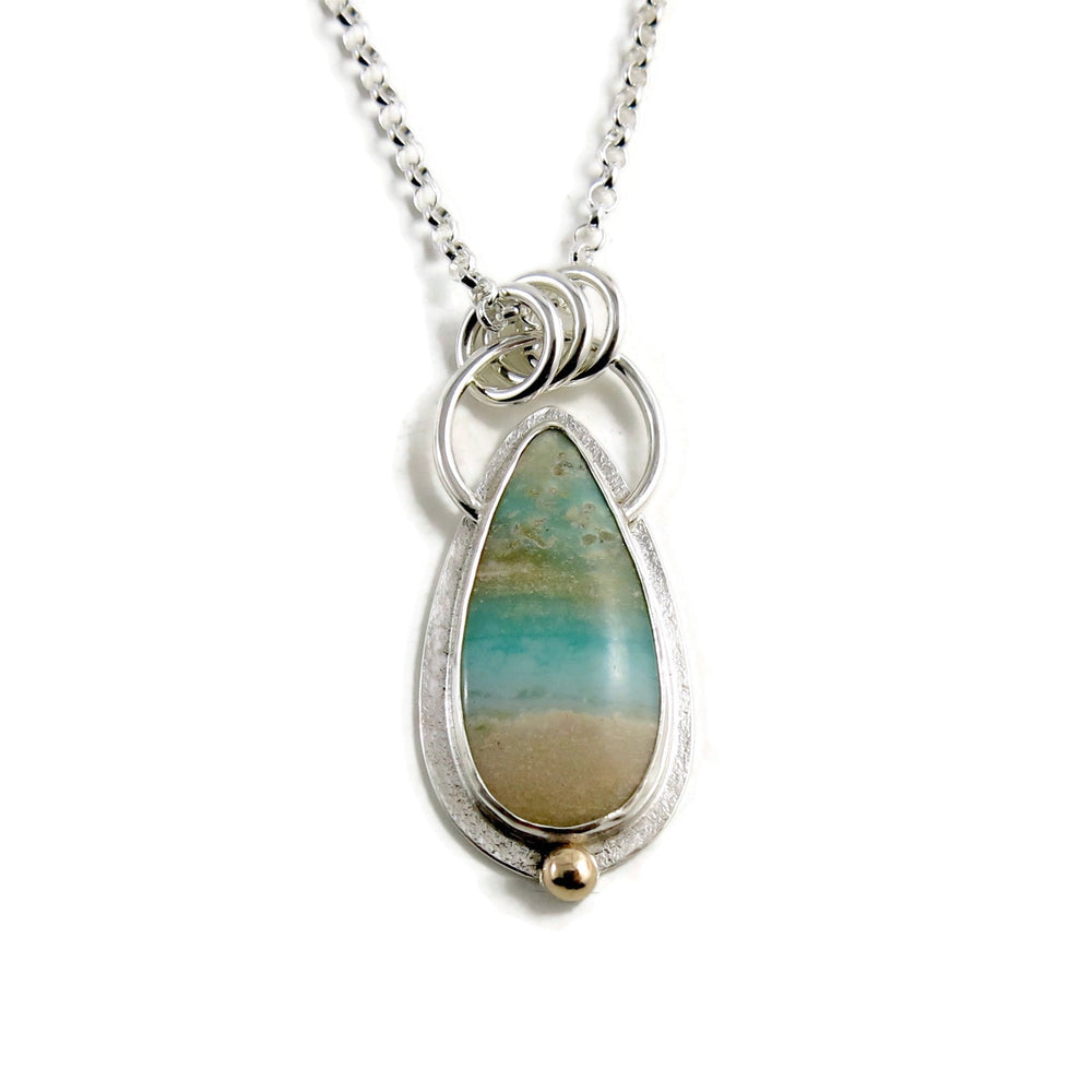 Tropical dreams necklace by Mikel Grant Jewellery. Opalized blue and cream fossil wood necklace in sterling silver with a 14K gold accent.