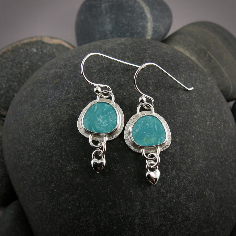 Turquoise love earrings by Mikel Grant Jewellery.  Bezel set turquoise with silver heart dangles.